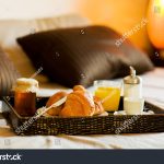 stock-photo-photo-of-tray-with-breakfast-food-on-the-bed-inside-a-bedroom-91789064